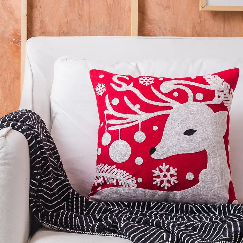 Red and gray embroidered christmas reindeer cushion cover with white snowflakes by decorbites christmas embroidered collection