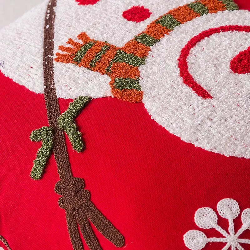 Red cushion cover featuring a textured embroidered snowman with scarf and snowflakes decorbites christmas embroidered pillowcase