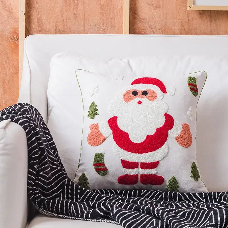 White cushion cover with decorbites christmas embroidered santa claus and green pine trees design