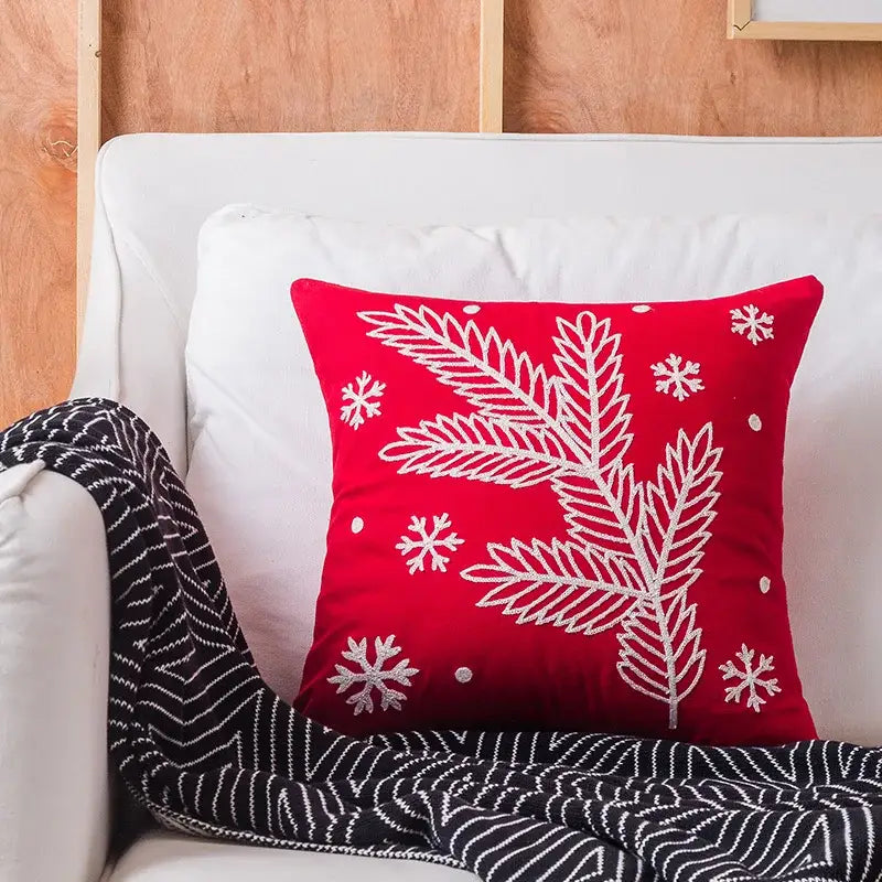 Red velvet decorbites christmas embroidered cushion cover with white embroidered pine branches and snowflakes design