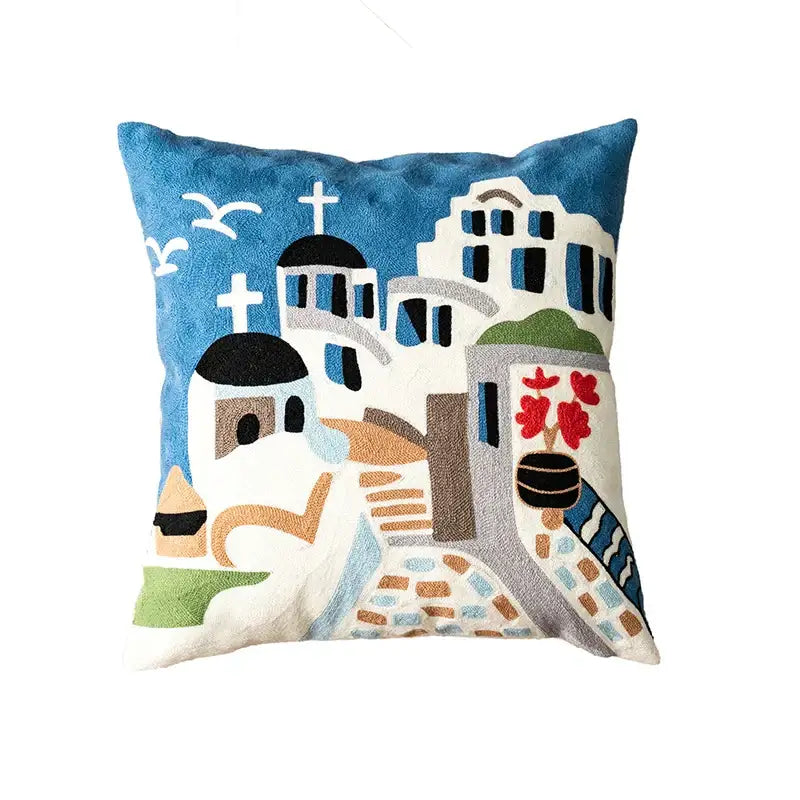 Blue and white decorbites christmas embroidered pillow cover featuring greek architecture with domed churches and red flowers