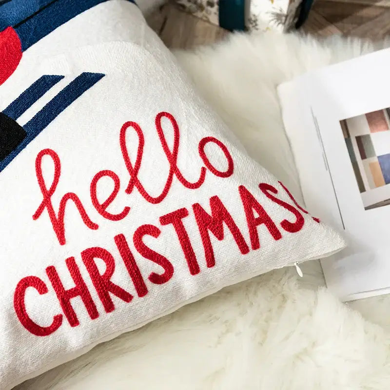 White embroidered pillow cover with red hello christmas text and blue accents decorbites christmas embroidered pillow