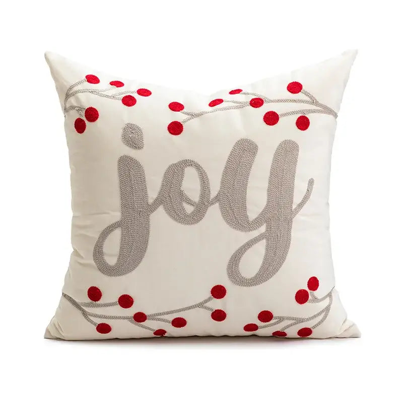 Cream-colored decorbites christmas embroidered cushion cover with joy in silver thread and red berry accents