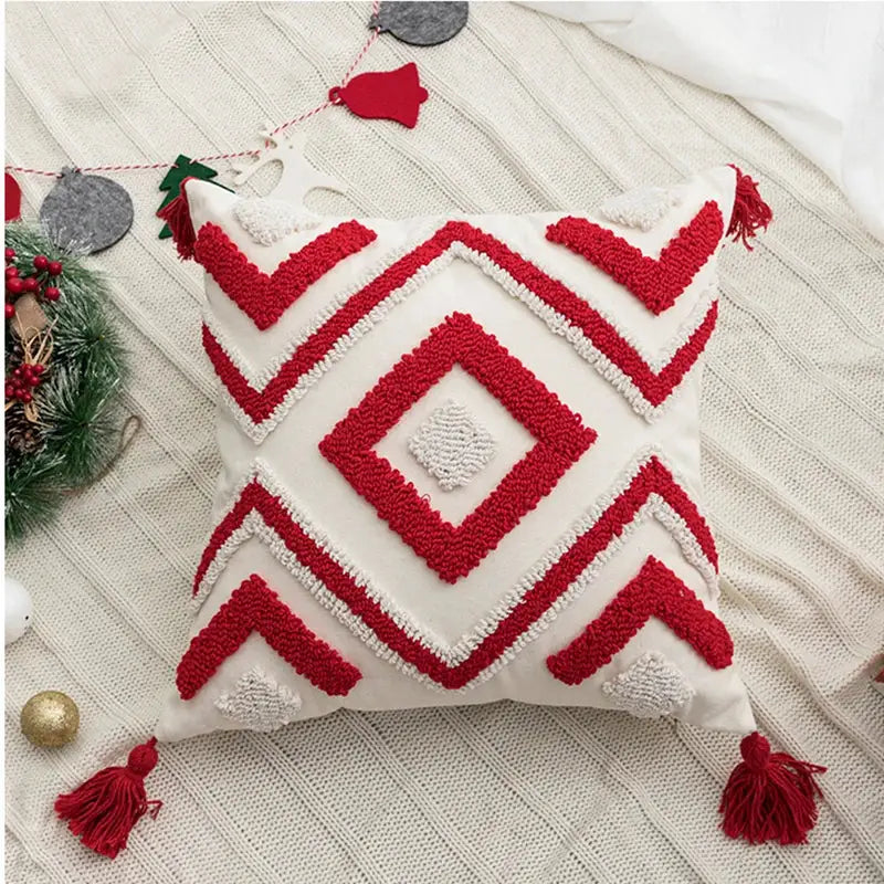 White cushion cover with red and white geometric tufted patterns and tassels decorbites christmas embroidered holiday design