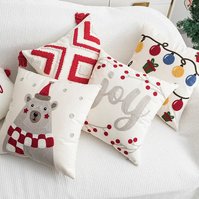 White christmas embroidered throw pillow cover with red geometric patterns and festive designs by decorbites christmas embroidered