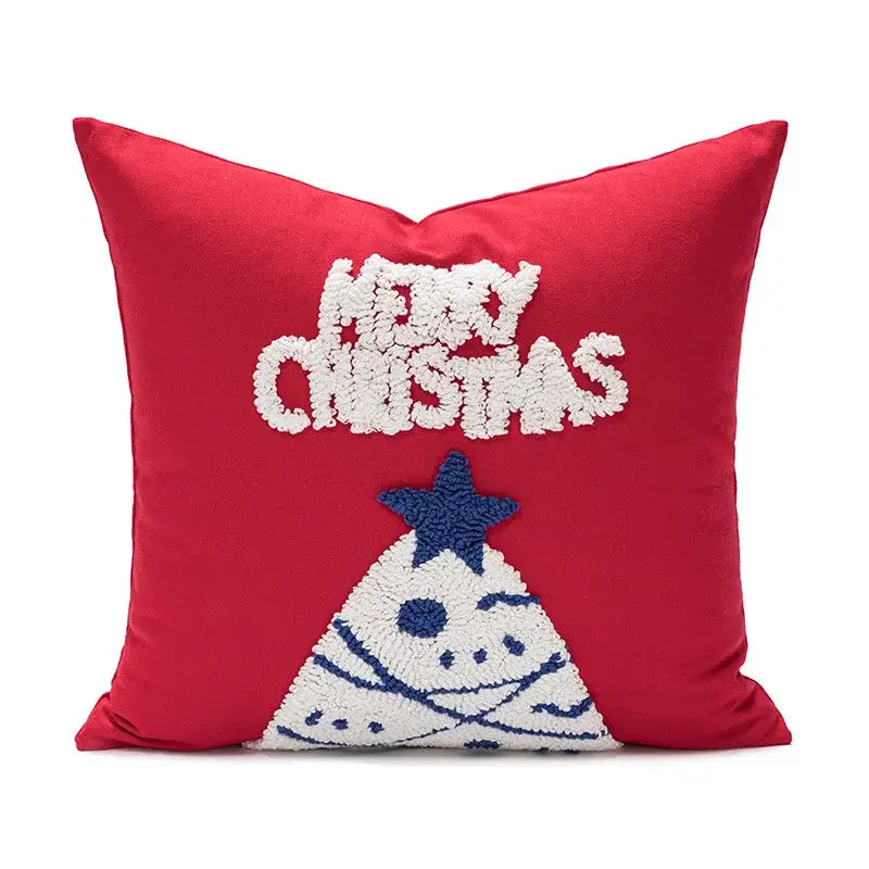 Red pillow cover with white and blue merry christmas embroidery above a festive tree design decorbites christmas embroidered