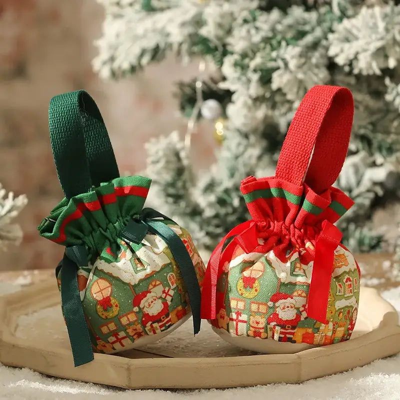 Two festive decorbites christmas eve apple bags with santa patterns in green and red drawstring fabric gift bags