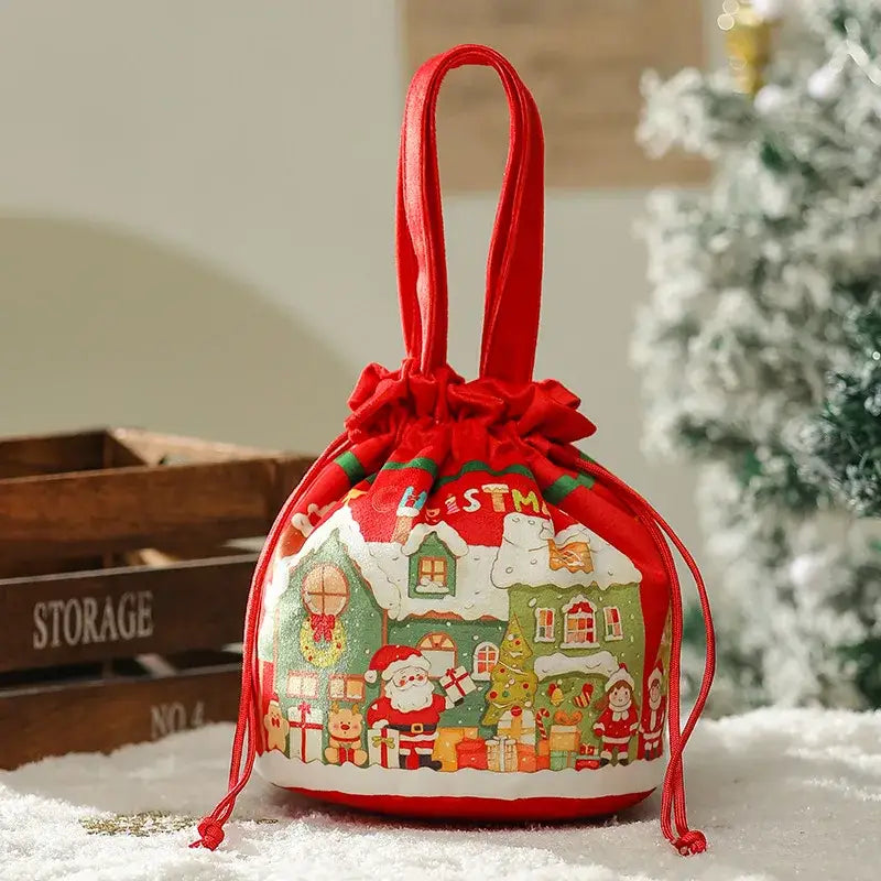 Red drawstring apple bag by decorbites christmas eve featuring santa snow-covered houses and presents on white base