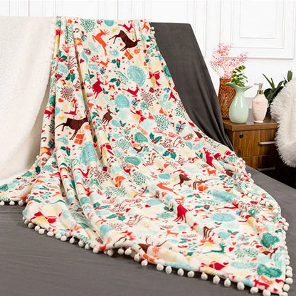 Decorbites christmas flannel cream plush blanket with festive reindeer pattern and white pom-pom edging for winter use