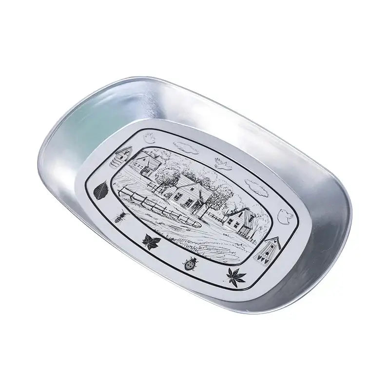 Silver oval christmas fruit tray with black-and-white pastoral scene and decorative santa claus snowman print