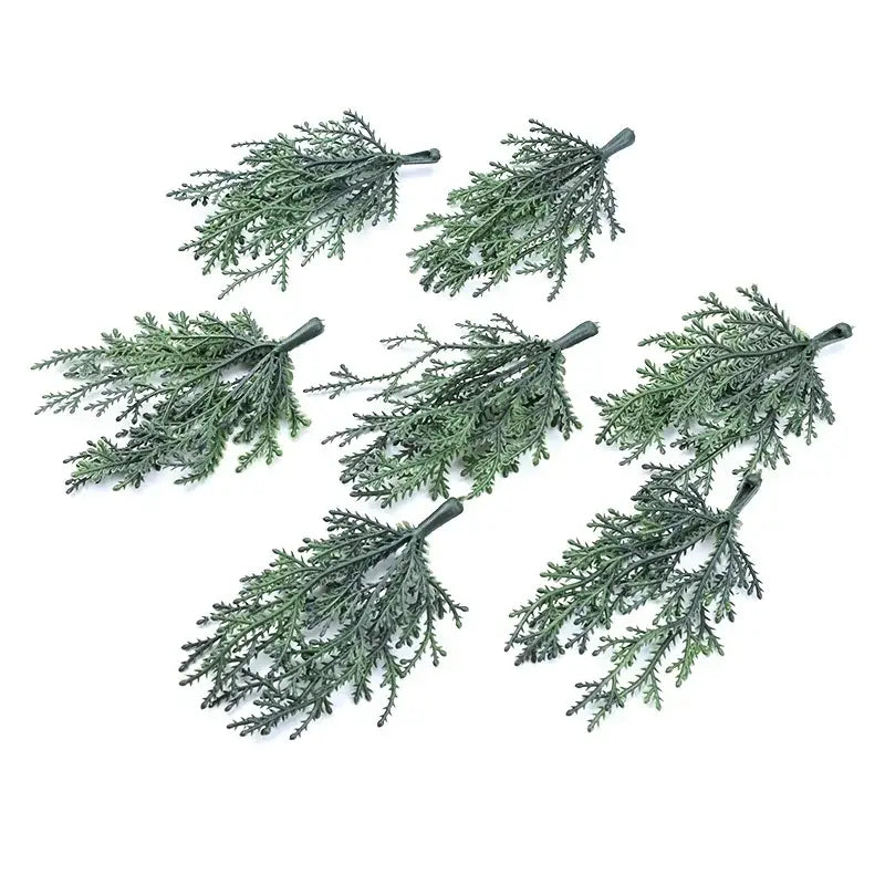 Six artificial green cedar-like foliage sprigs with textured leaves and dark stems for decorbites christmas garland home decor