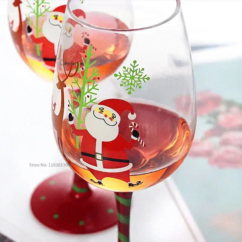 Decorbites™ christmas glass goblet set featuring clear glass goblet with santa claus, candy cane, tree, and green snowflakes