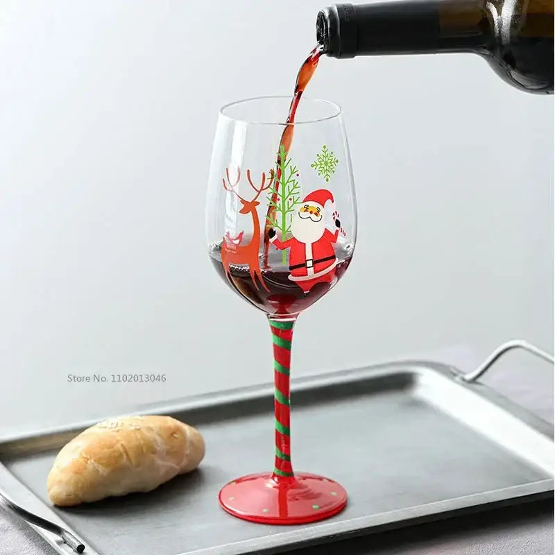 Decorbites christmas glass goblet set featuring a festive red and green striped santa claus design with reindeer and snowflakes