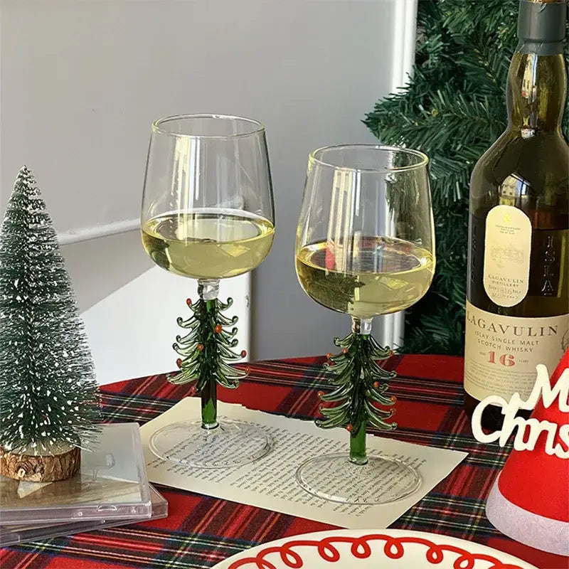 Decorbites™ christmas glass goblet set featuring two clear glass goblets with green tree-shaped stems and red ornaments