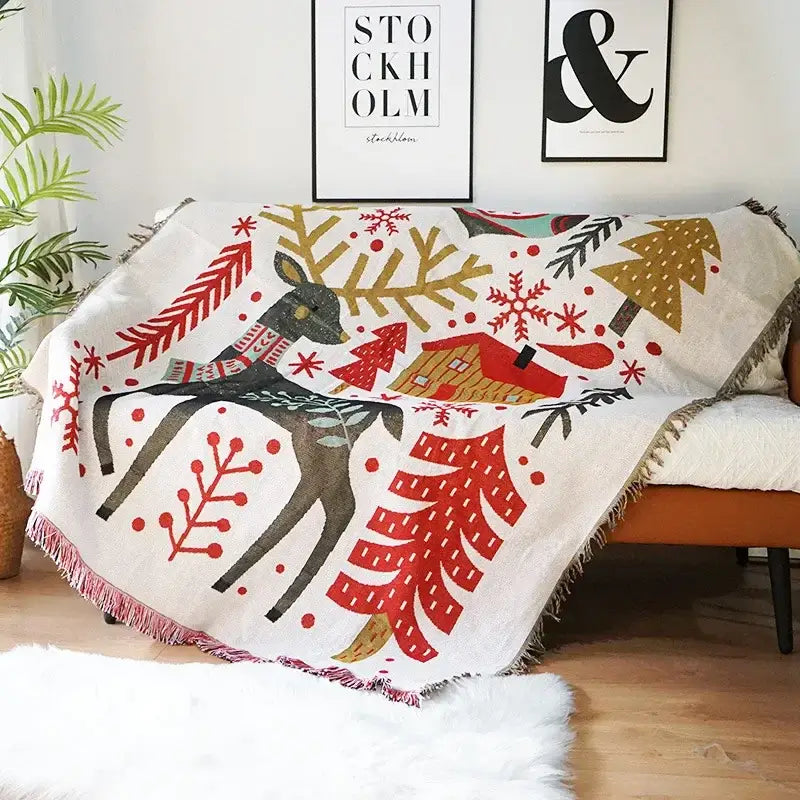 Cozy cream cream-colored woven decorbites christmas holiday sofa blanket with black deer and festive winter scene