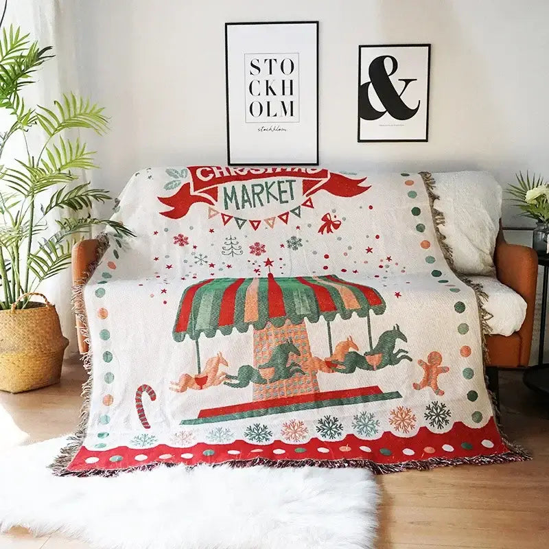 White decorbites christmas holiday sofa blanket with colorful carousel design and festive holiday accents