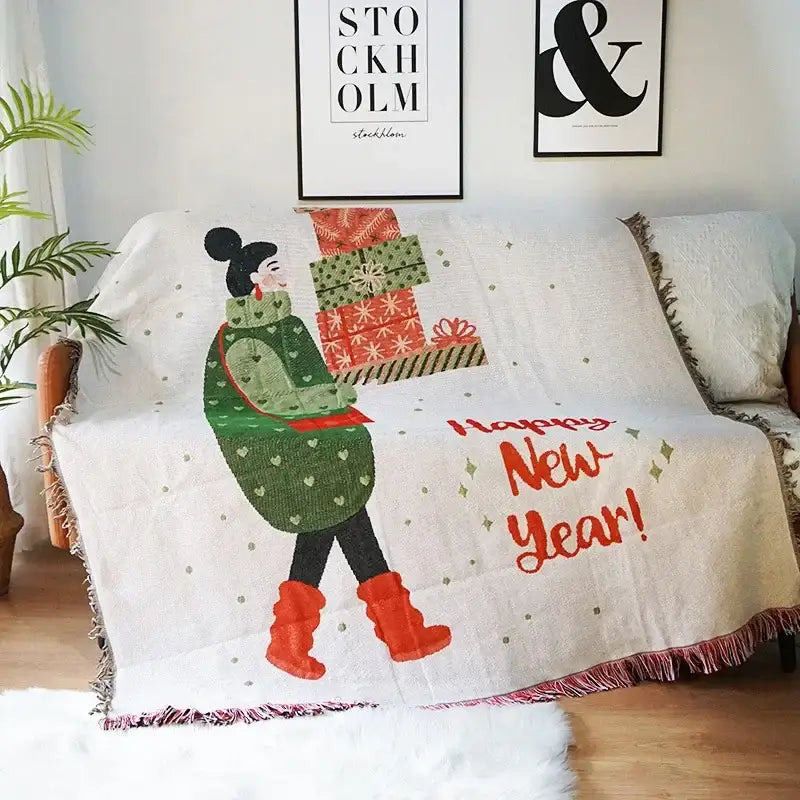 White decorbites christmas holiday sofa blanket with festive woman illustration and happy new year embroidery in orange