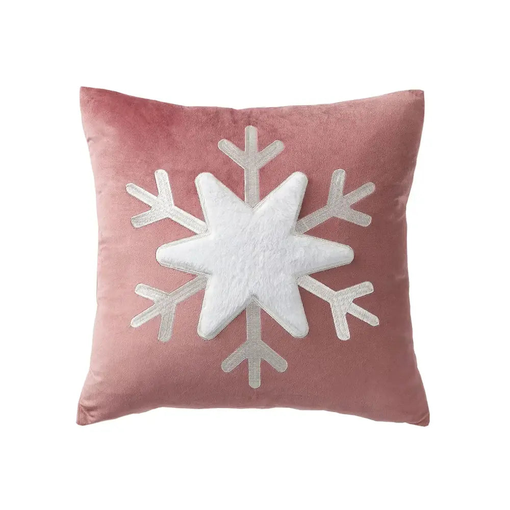 A plush pink velvet pillow cover with a white snowflake and silver embroidery from decorbites christmas jacquard elk collection
