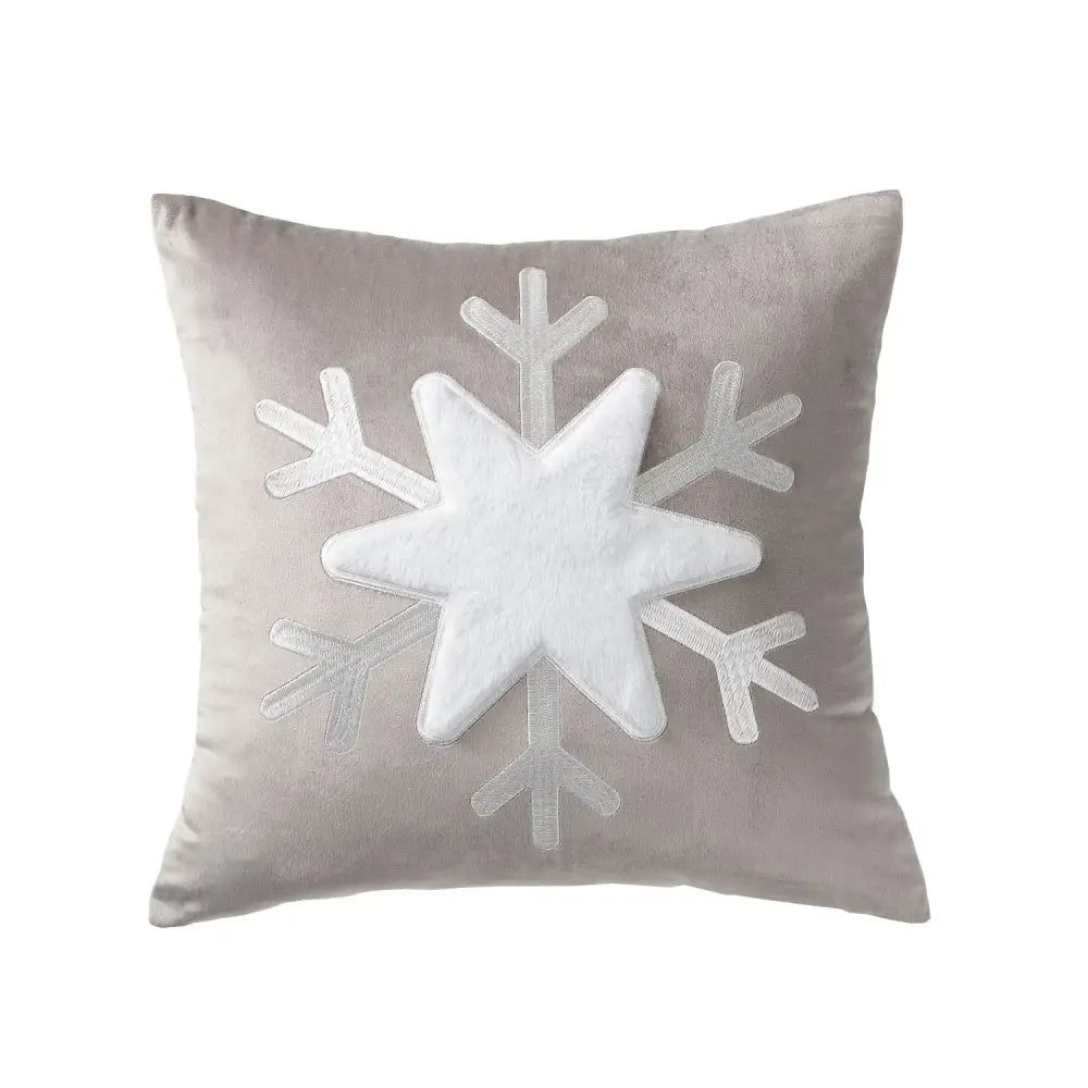A plush gray pillow cover with a white textured snowflake appliqué from decorbites christmas jacquard elk collection