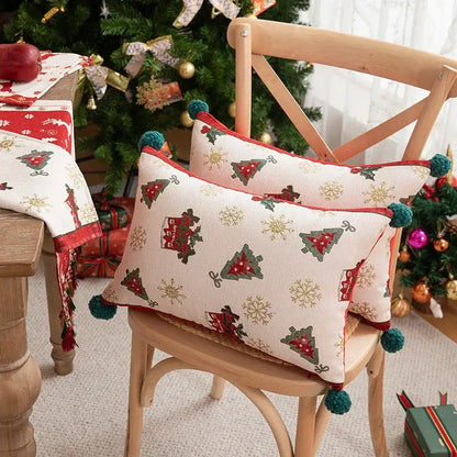 Cream-colored decorbites christmas jacquard pillow cover with red green tree patterns gold snowflakes and teal pom-poms