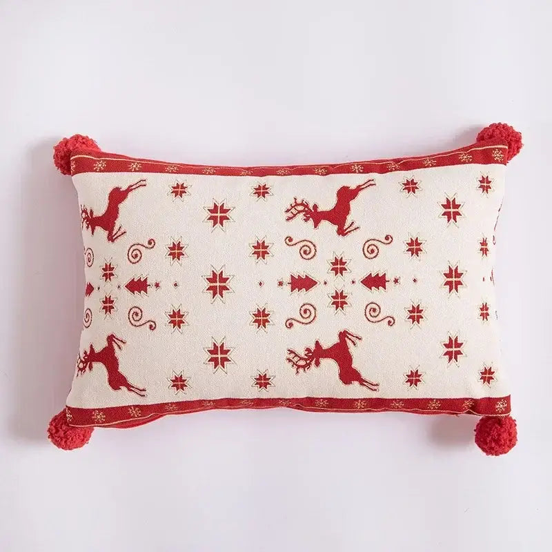 Cream-colored pillow cover with red embroidered reindeer stars trees and pom-poms decorbites christmas jacquard elk design