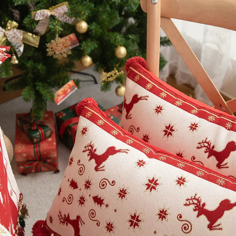 Red reindeer and snowflake patterned pillow cover with pom-pom trim from decorbites christmas jacquard elk collection