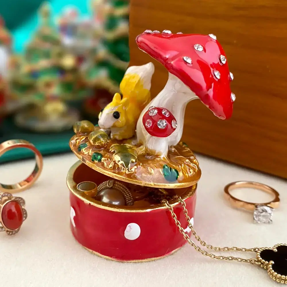 DecorBites™ red and white mushroom-shaped jewelry trinket box with yellow squirrel figurine and rhinestone details