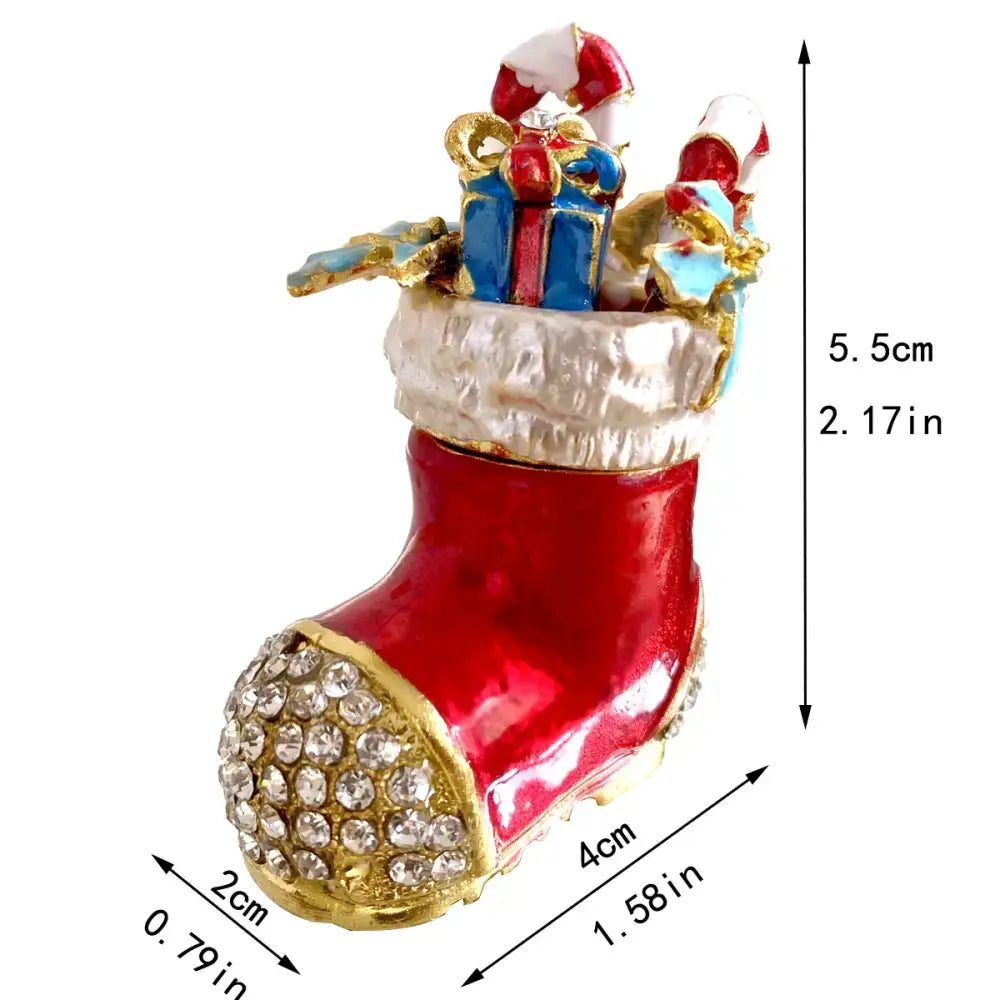 A festive red and gold christmas jewelry trinket box adorned with rhinestones and filled with miniature gifts and candy canes