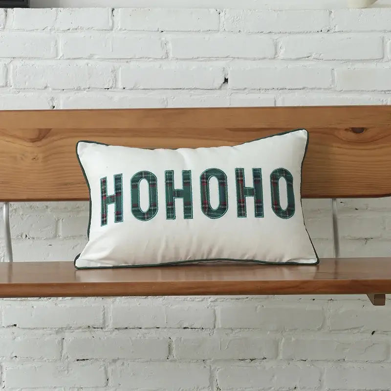 White rectangular pillow with green plaid ho ho ho lettering and border in decorbites christmas letter embroidery set