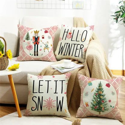 Four festive decorbites christmas letter pillow covers with nutcracker, christmas tree, and hello winter prints on linen