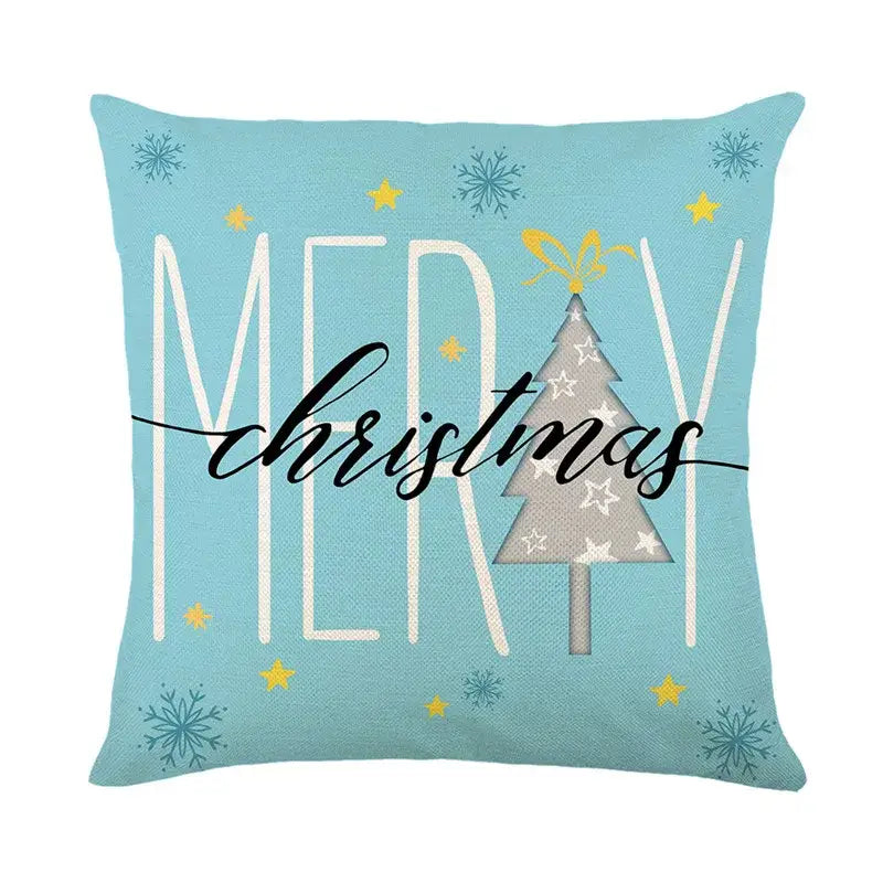 Light blue linen pillow cover with decorbites christmas letter print featuring festive tree and merry christmas text