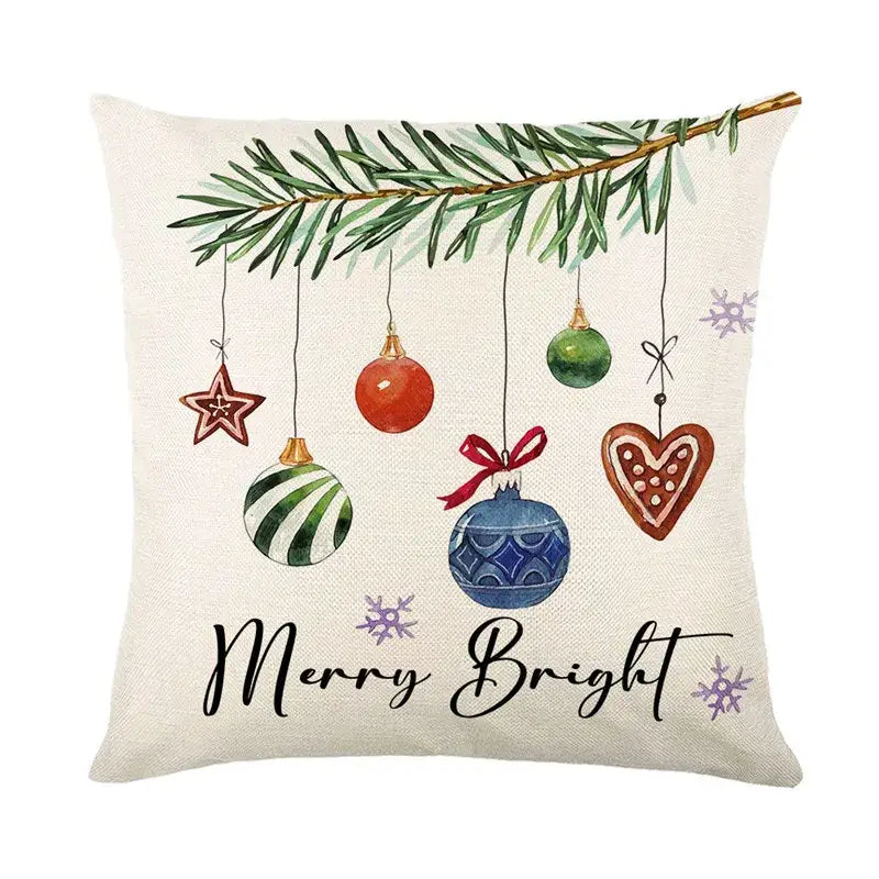 Beige linen pillow cover with decorbites christmas letter print featuring festive ornaments and merry bright script