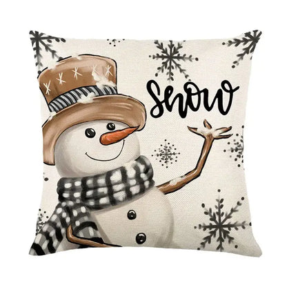 Beige linen throw pillow cover with decorbites christmas letter print featuring a snowman and black snowflake patterns