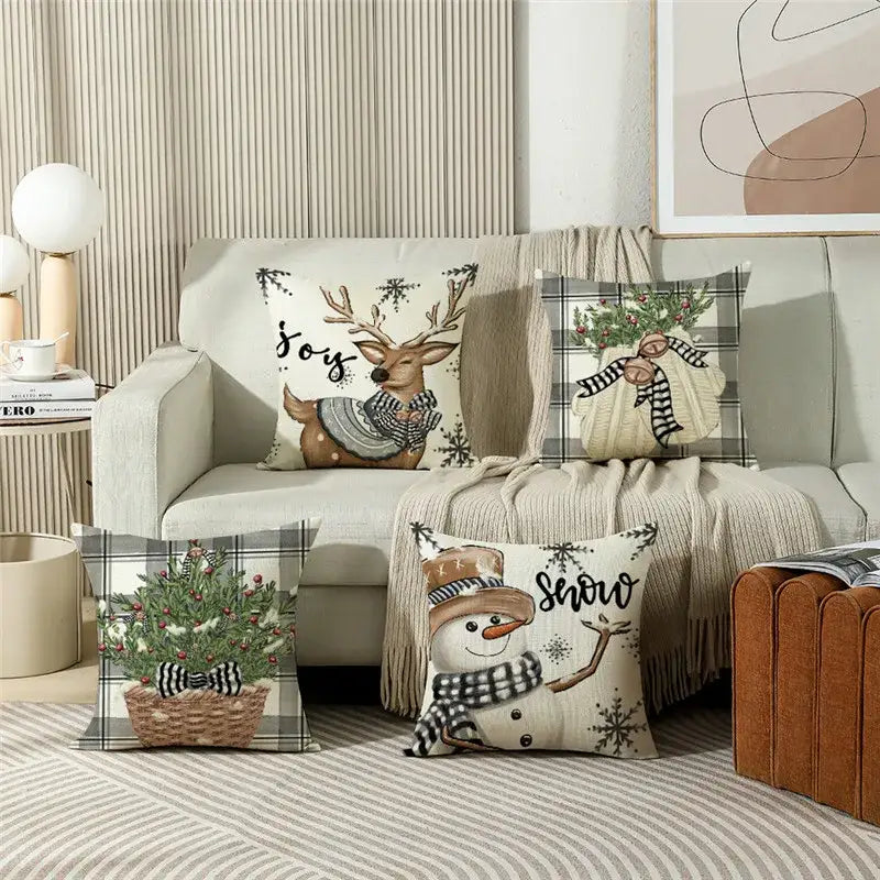 Set of four decorbites christmas letter linen pillow covers with festive reindeer snowman plaid designs in neutral tones