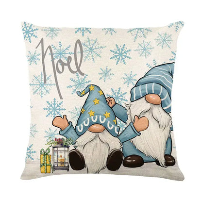Beige linen pillow cover featuring decorbites christmas letter print with two blue gnomes and noel text for holiday decor