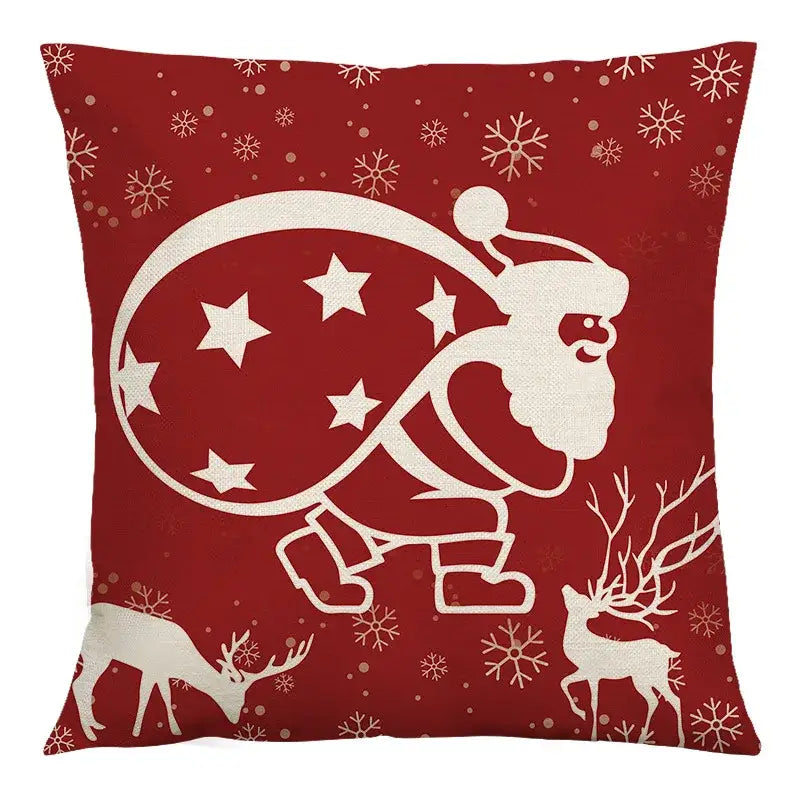 Red holiday cushion cover featuring white santa silhouette with sack stars reindeer snowflakes decorbites christmas linen