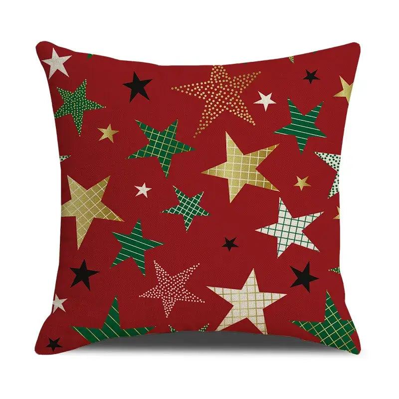 Red throw pillow cushion cover with festive star pattern in green gold black and white from DecorBites Christmas linen collection