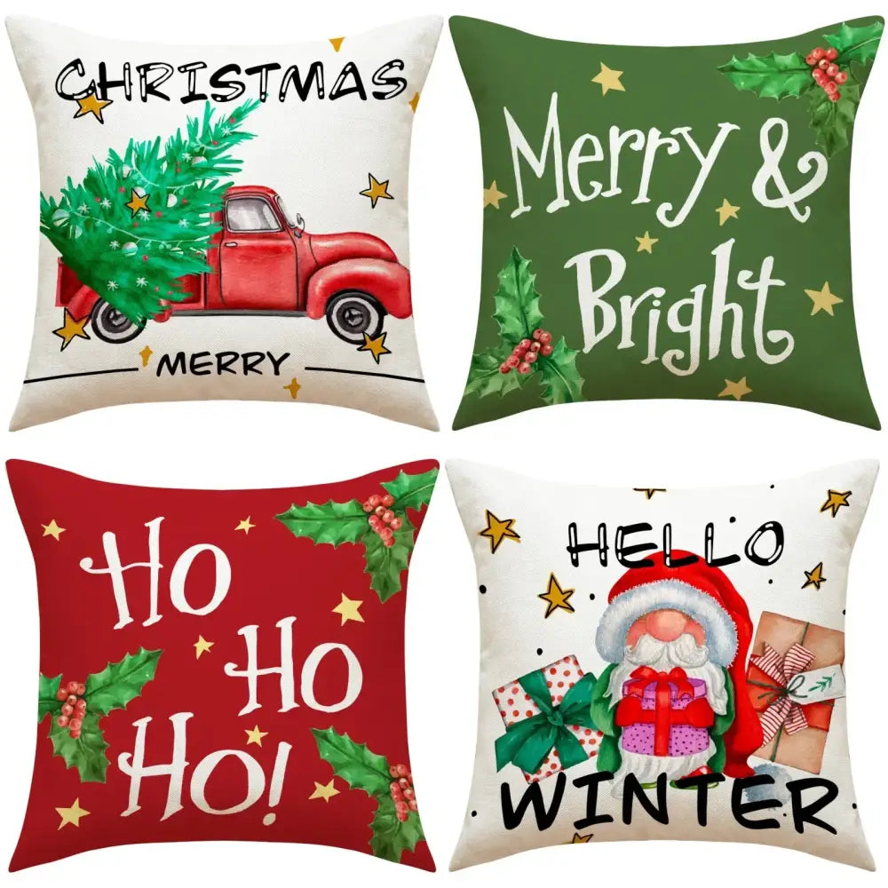 Four festive christmas linen decorative pillows with holiday prints including a red truck, merry and bright text, ho ho ho, and santa design