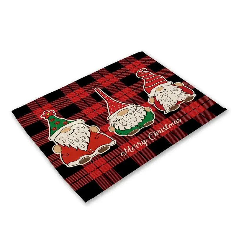 Red and black plaid linen dining table mats featuring three cartoon gnomes for festive holiday decor