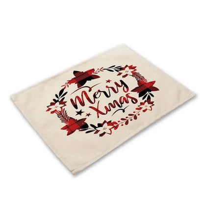 Cream-colored linen dining table mats featuring festive merry xmas design with red and black plaid holiday motifs