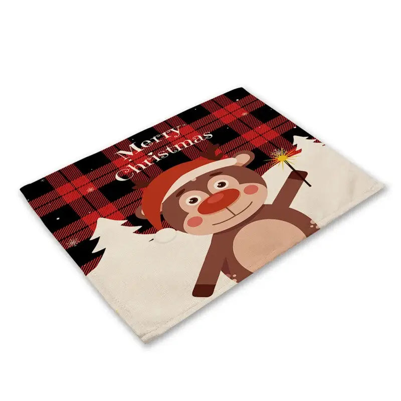 A festive linen dining table mat with a cartoon reindeer in a santa hat on a black and red plaid background
