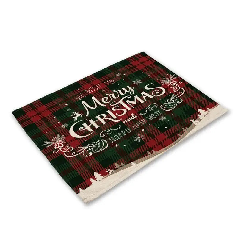 DecorBites™ red and green plaid linen dining table mats with festive Christmas text and holiday-themed prints