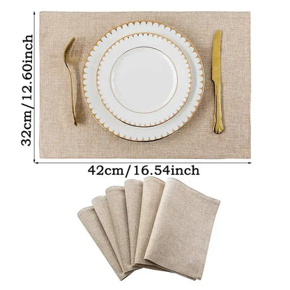 Beige linen dining table mats with gold-trimmed scalloped edge and matching napkins in decorbites™ christmas style