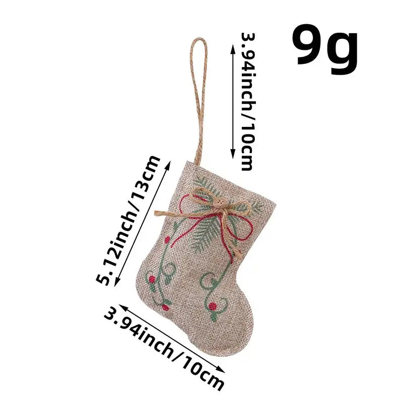 A beige burlap decorbites christmas linen pendant with embroidered green pine branches and red berries printed pentagram sock