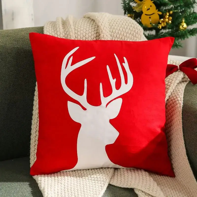 Red square velvet cushion cover with white deer silhouette design from decorbites christmas patchwork merrychristmas collection
