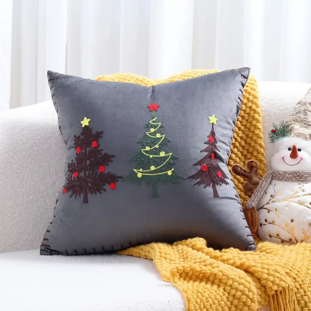 Gray velvet cushion cover with embroidered Christmas trees in brown green and yellow by DecorBites Christmas Patchwork MerryChristmas