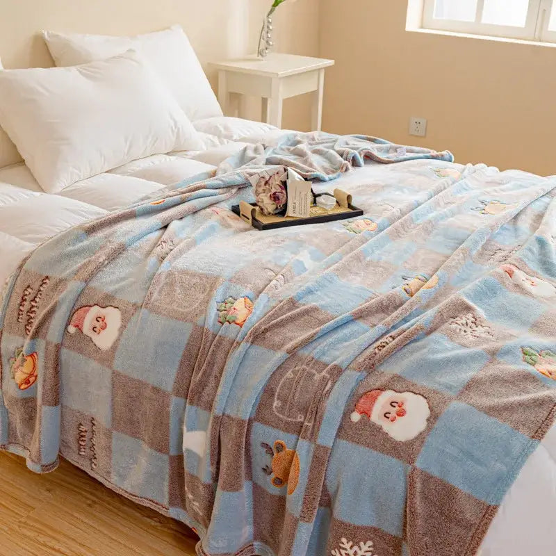 Cozy light blue and brown DecorBites Christmas pattern printed soft blanket with embroidered Santa faces and snowflakes