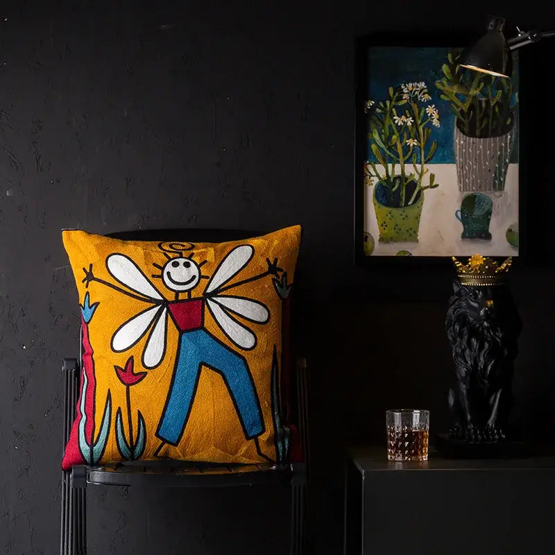 Vibrant yellow cushion cover with whimsical embroidered fairy in decorbites christmas picasso style for sofa and bed