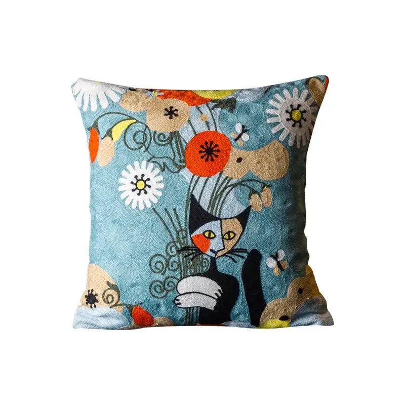 Square cushion cover with whimsical black and white cat embroidery on teal decorbites christmas picasso style design