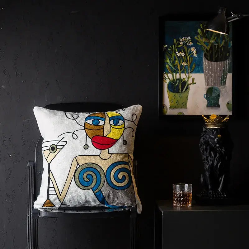 White cushion cover with embroidered abstract face in blue red and gold decorbites christmas picasso style for sofa and bed